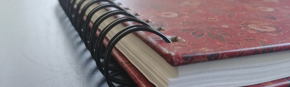 Close up of a red notebook